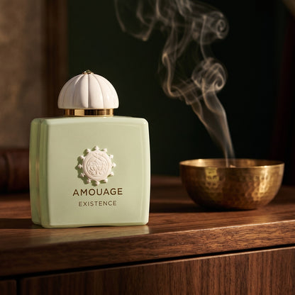 Amouage Existence EDP on aged walnut board with dried agarwood shavings scattered loosely