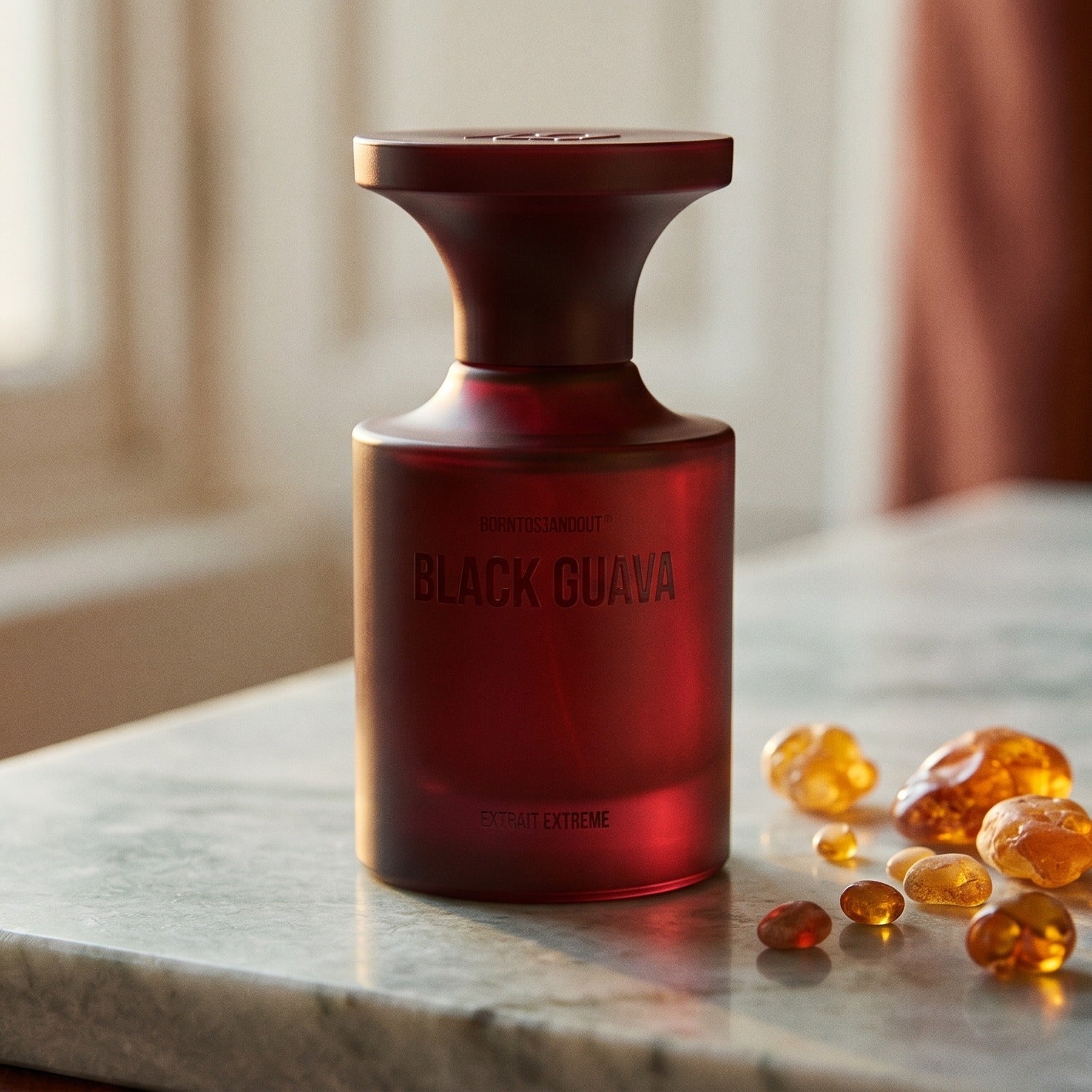 Borntostandout Black Guava Extrait Extreme on warm ivory travertine with labdanum chunks clustered by the base