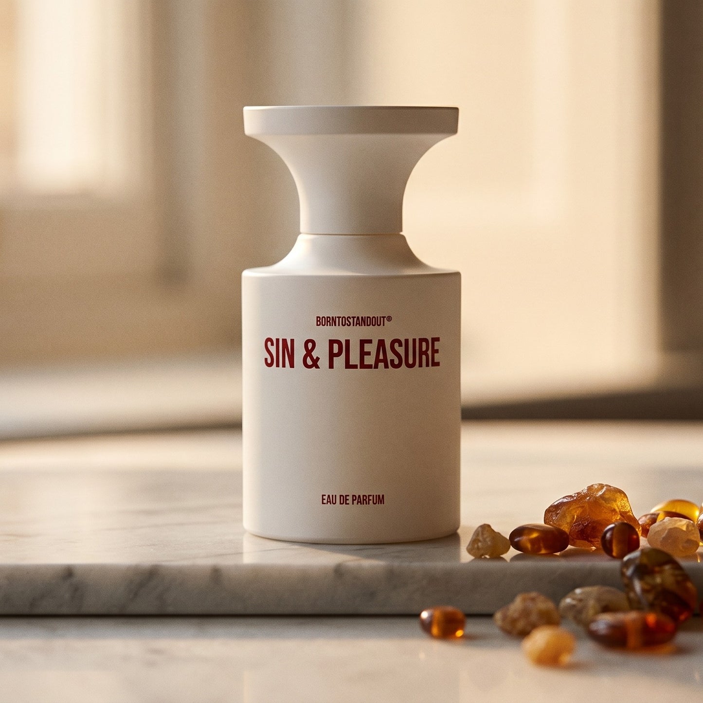 Borntostandout Sin & Pleasure EDP on warm taupe marble with copal beads spilling from a small dish