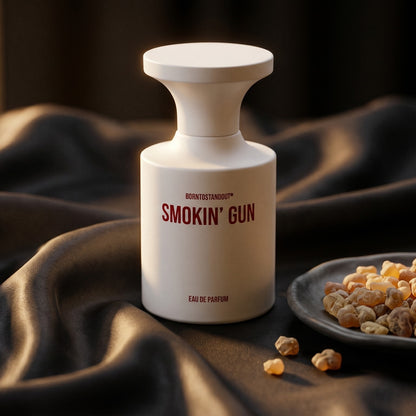 Borntostandout Smokin Gun EDP on charcoal silk with frankincense resin granules in a small saucer