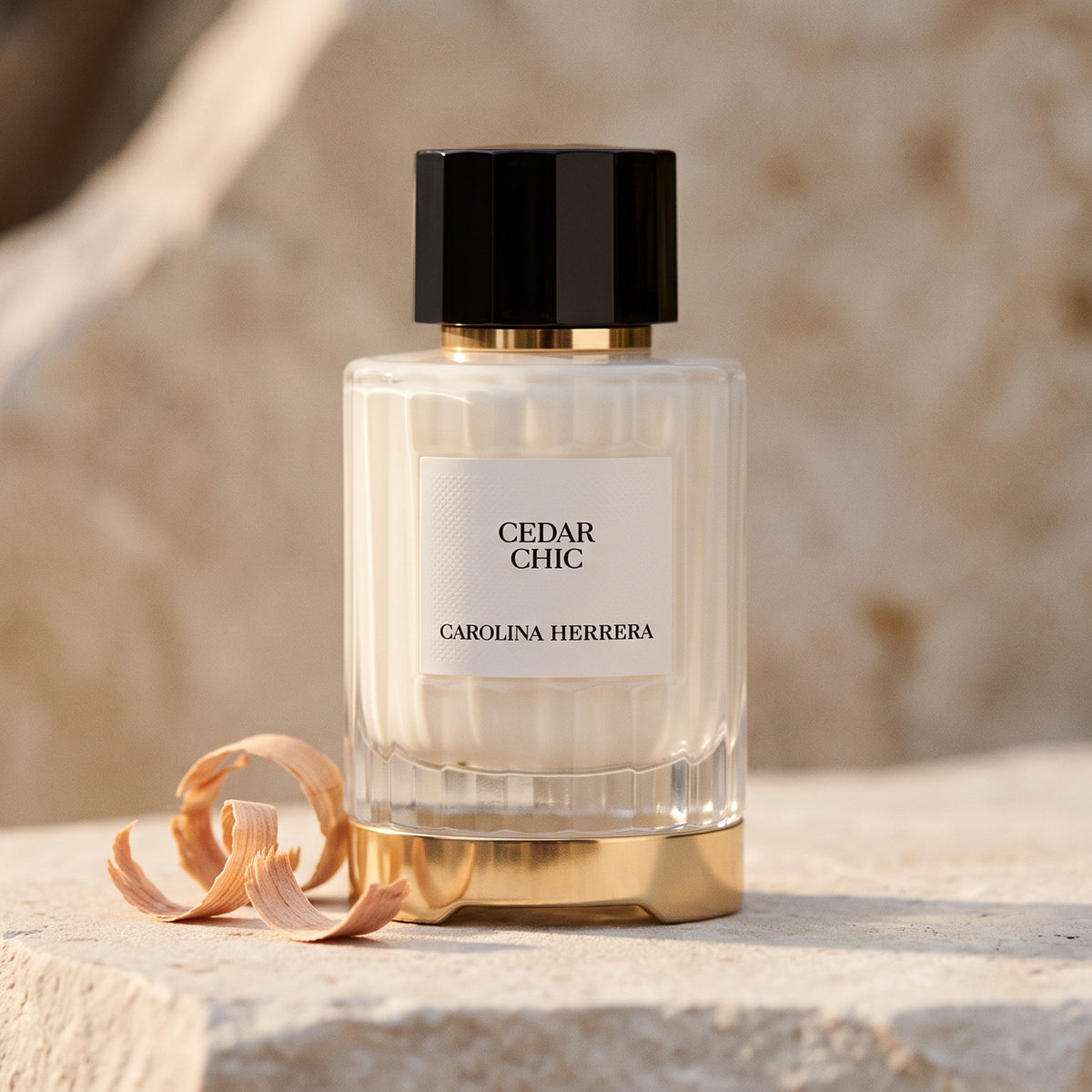 Carolina Herrera Cedar Chic EDP on pale stone with a few curls of cedar shavings