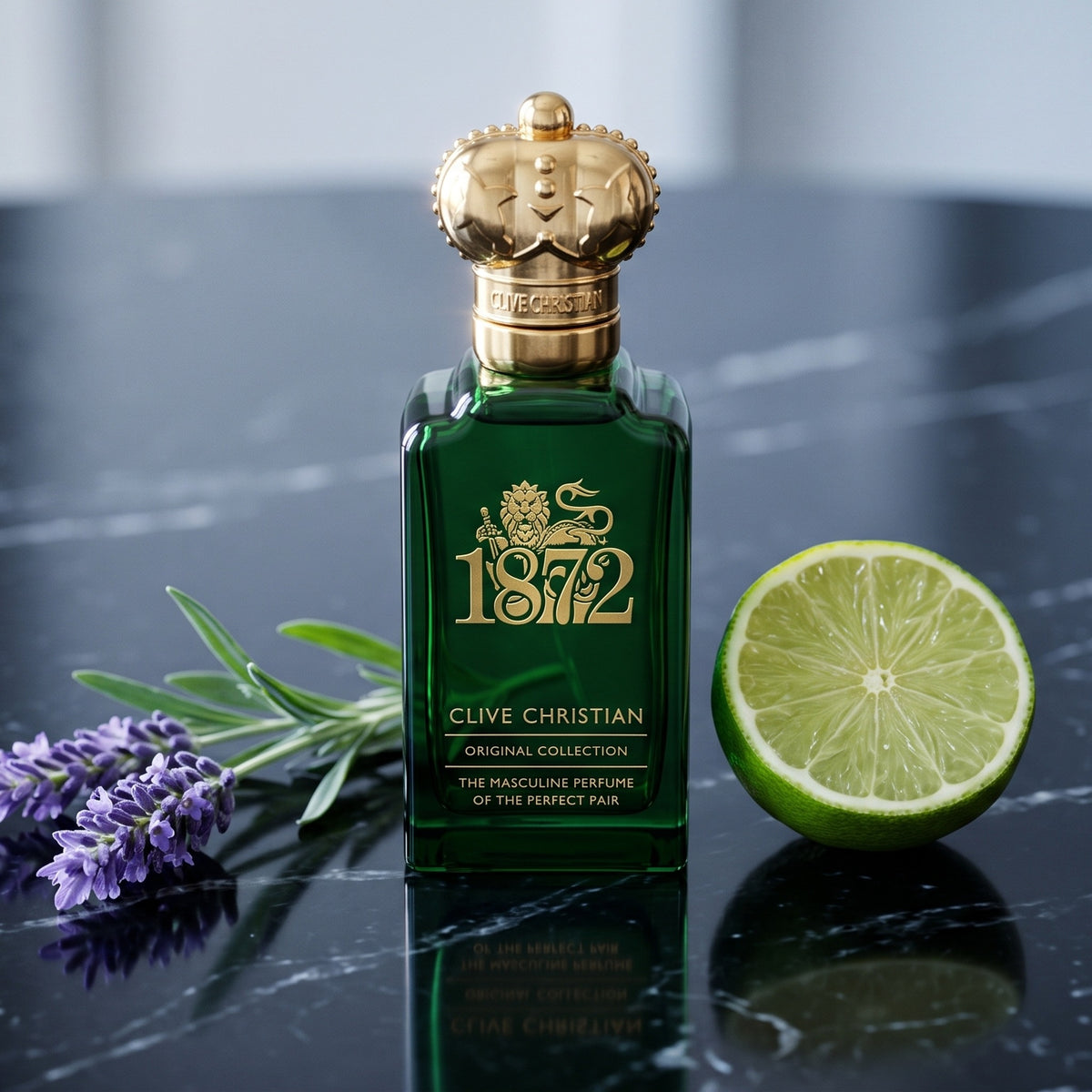 Clive Christian 1872 Masculin on black marble with a sprig of lavender and a halved lime