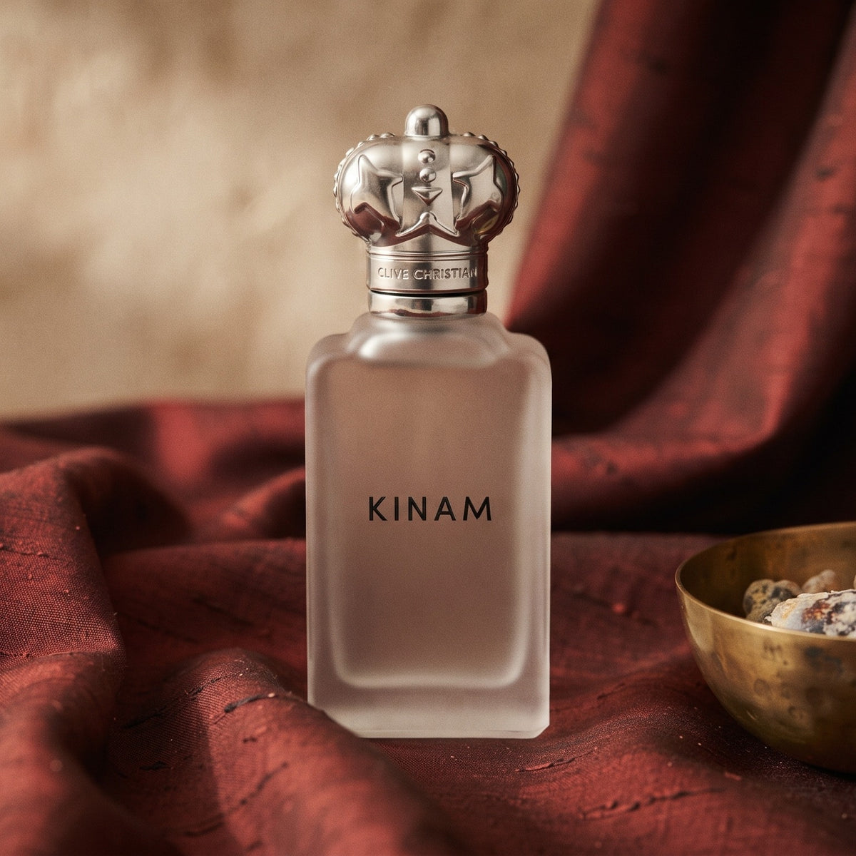 Clive Christian Kinam Parfum - Dubai Exclusive on raw silk of oxblood color with a brass bowl with ambergris tincture