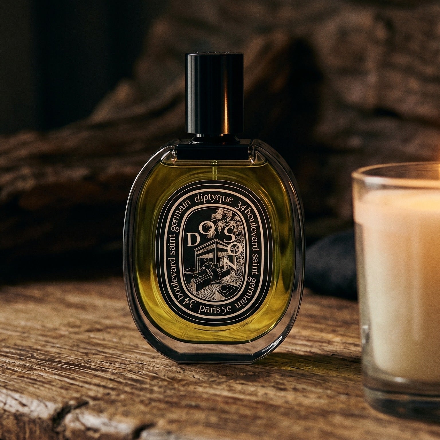 Diptyque Doson EDP on rosewood surface with a squat brass candle flickering nearby