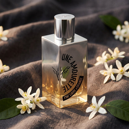 Etat Libre Une Amourette EDP on charcoal linen with neroli blossoms