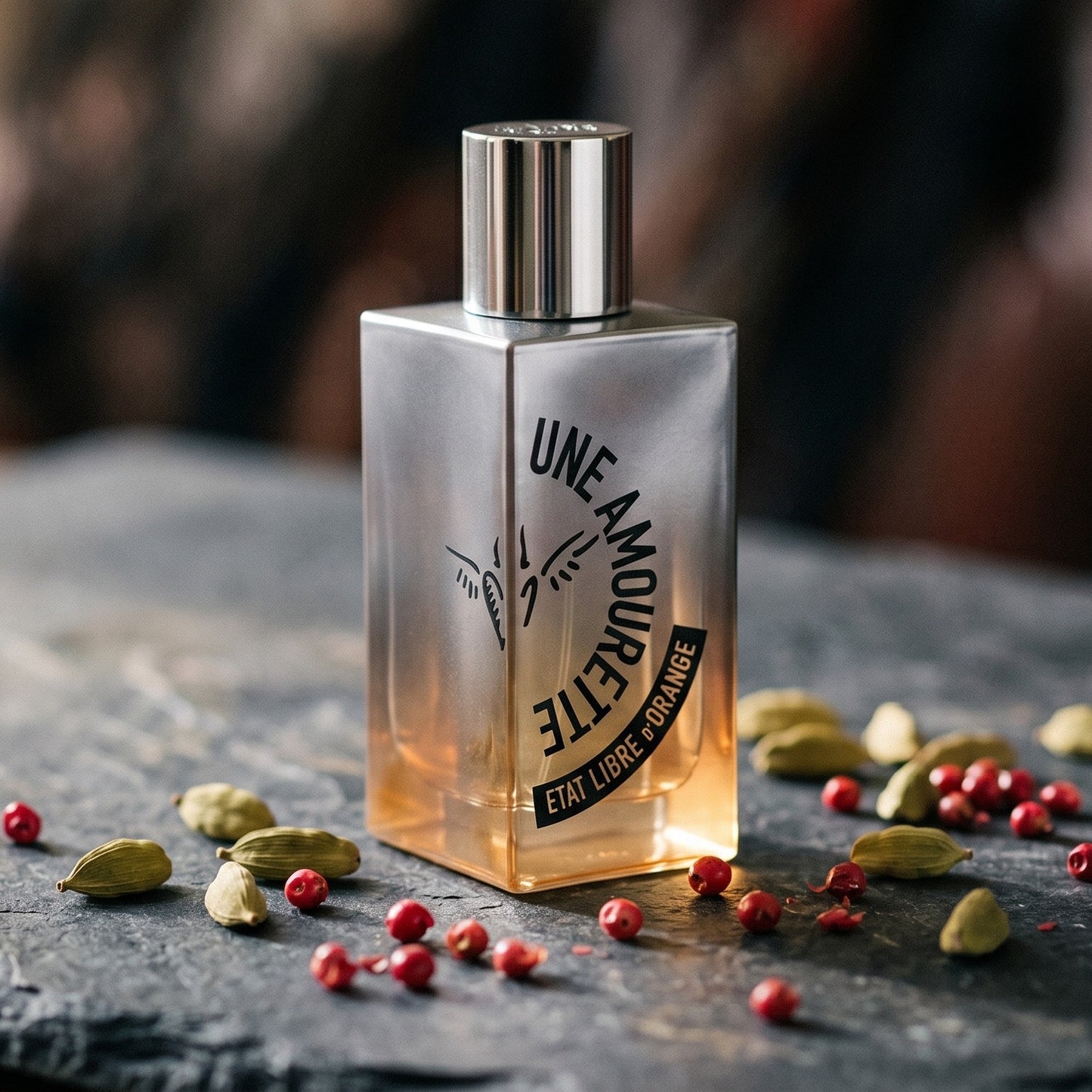 Etat Libre Une Amourette EDP on blackened stone with a small copper tin of cumin and coriander