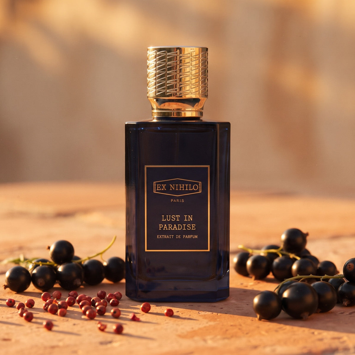 Ex Nihilo Lust in Paradise Extrait de Parfum on warm terracotta stone at sunset with blackcurrants and pink peppercorns
