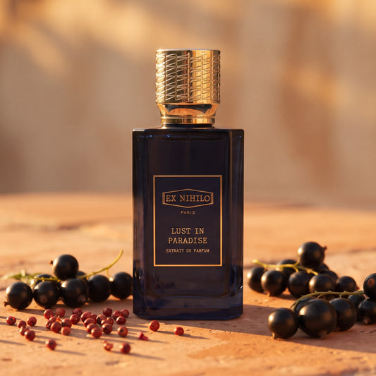 Ex Nihilo Lust in Paradise Extrait de Parfum on warm terracotta stone at sunset with blackcurrants and pink peppercorns