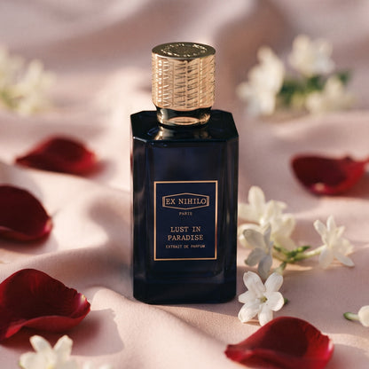 Ex Nihilo Lust in Paradise Extrait de Parfum on pale pink silk with rose petals and jasmine