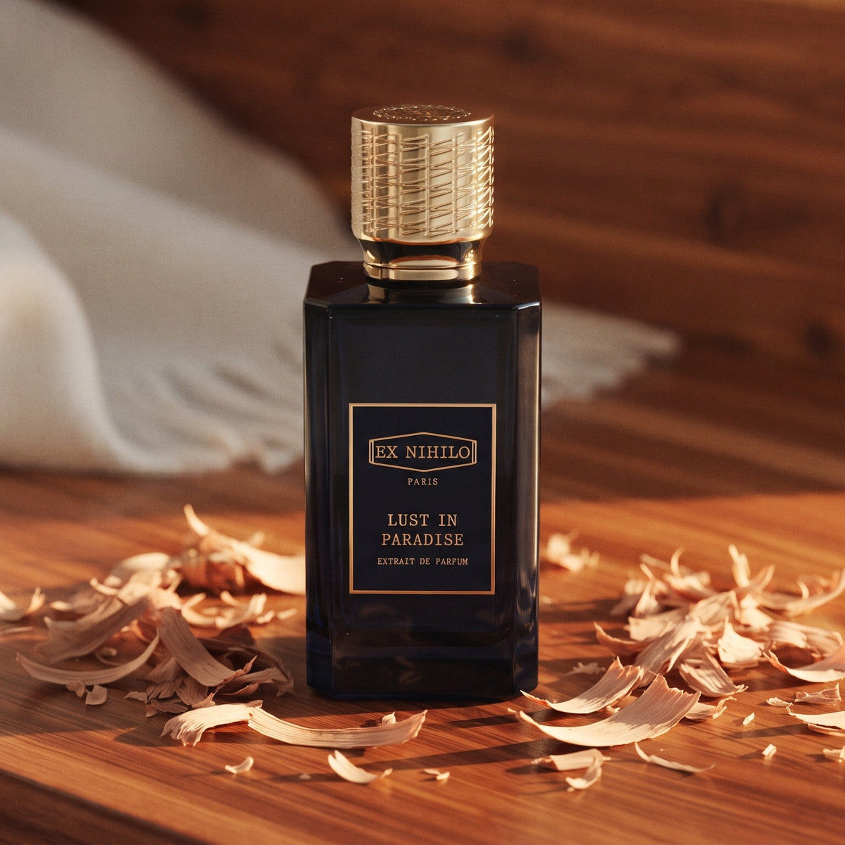 Ex Nihilo Lust in Paradise Extrait de Parfum on polished cedarwood with cedar shavings and cashmere