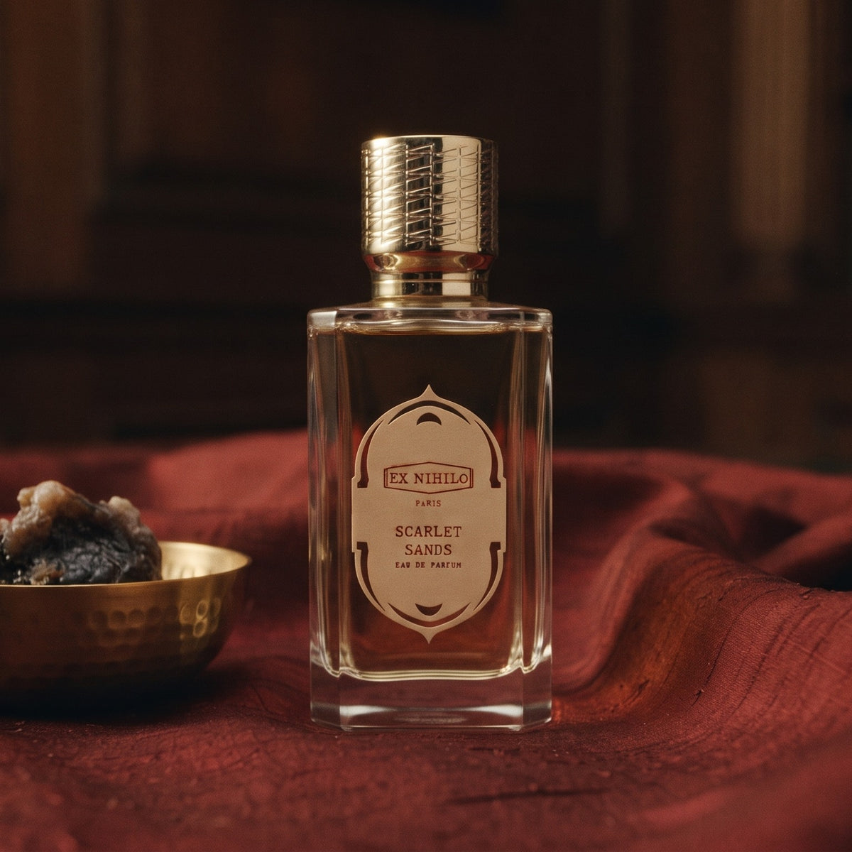 Ex Nihilo Scarlet Sands EDP - Dubai Exclusive on raw silk of oxblood color with a brass bowl with ambergris tincture