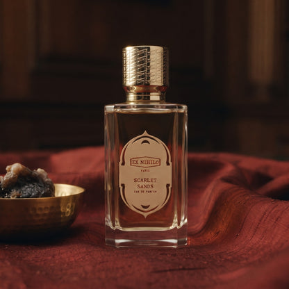 Ex Nihilo Scarlet Sands EDP - Dubai Exclusive on raw silk of oxblood color with a brass bowl with ambergris tincture