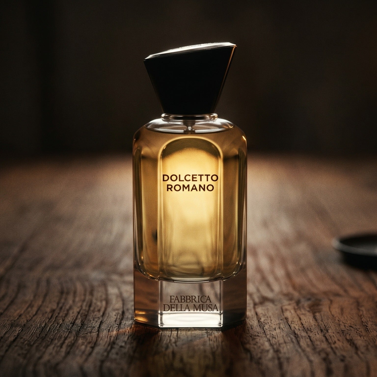 Fabbrica Della Musa Dolcetto Romano EDP on dark cherrywood with a tall beeswax taper casting warm light