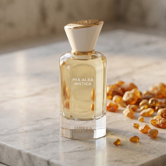 Fabbrica Della Musa Mia Alba Misica EDP on warm ivory travertine with labdanum chunks clustered by the base