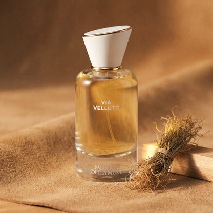 Fabbrica Della Musa Via Velluto EDP on tan suede leather with dried vetiver roots and sandalwood