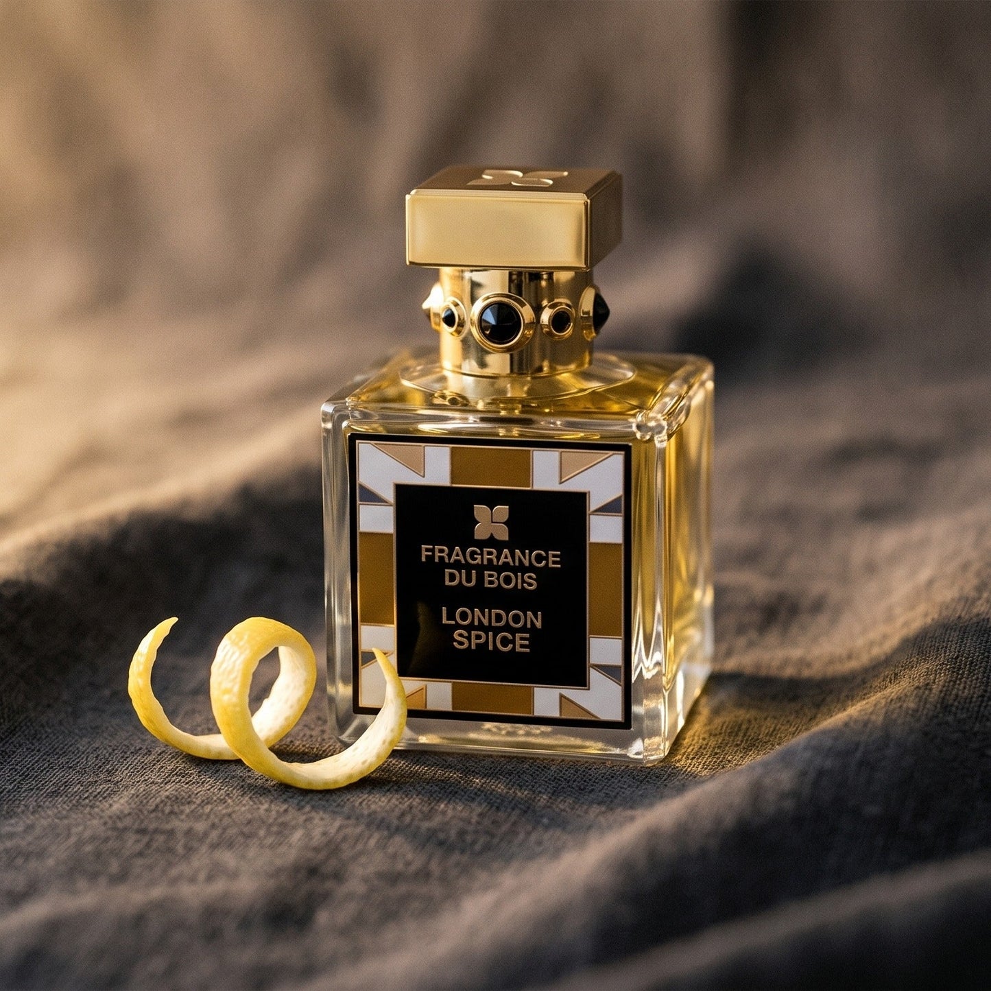 Fragrance Du Bois London Spice on charcoal linen with a curl of lemon peel