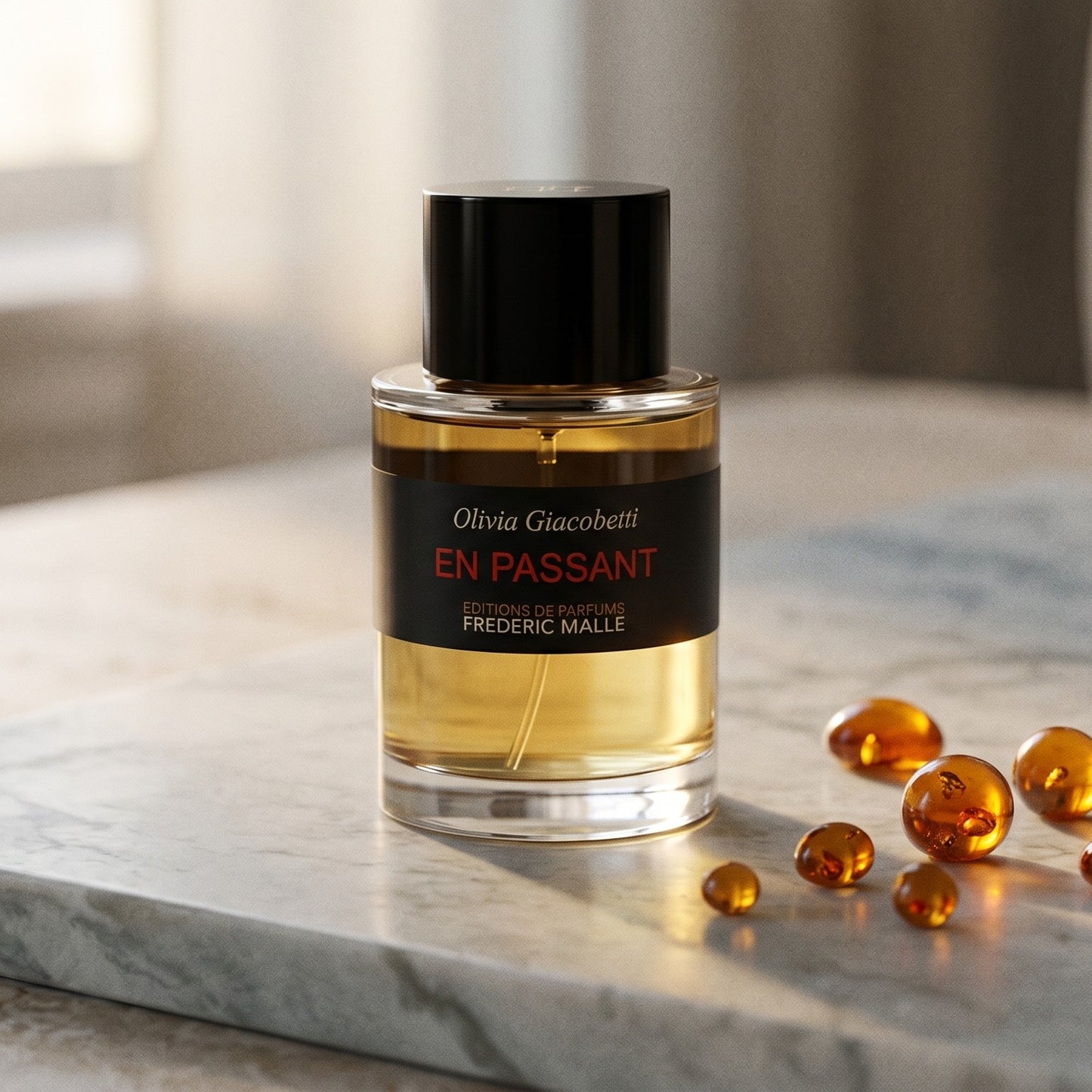 Frederic Malle En Passant EDP on warm ivory travertine with labdanum chunks clustered by the base