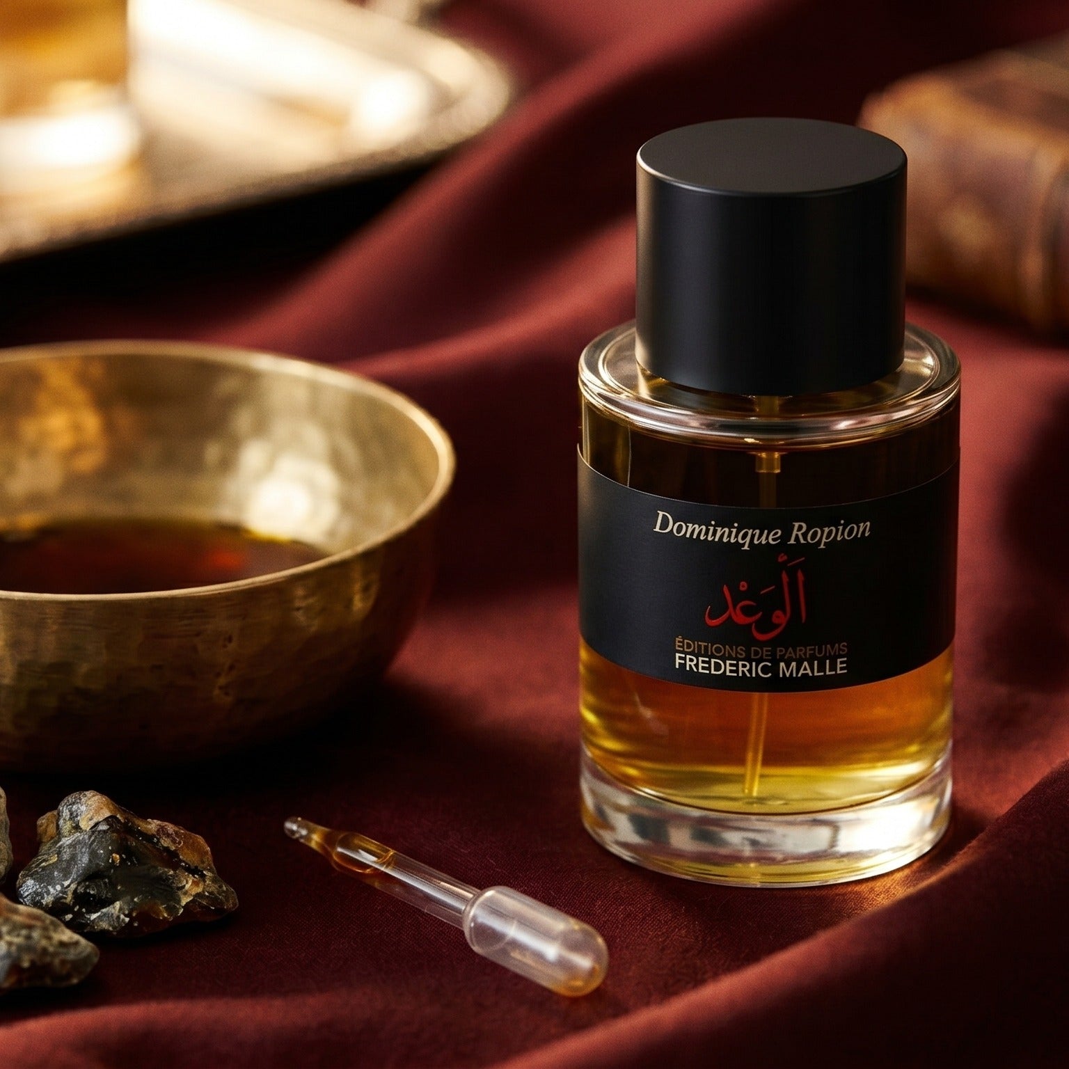 Frederic Malle Promise Parfum on cinnamon-tone silk with a shallow saucer of warm benzoin resin
