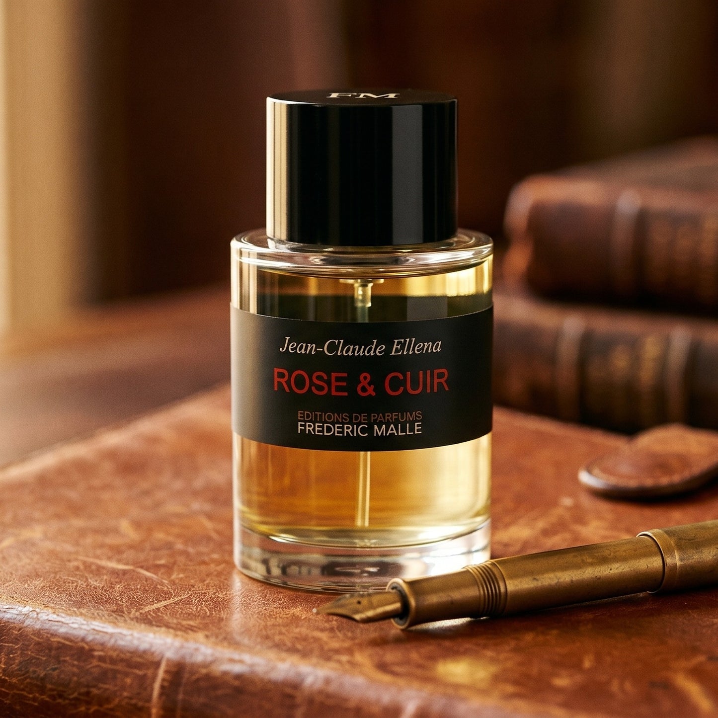 Frederic Malle Rose & Cuir EDP on vintage oxblood leather chair arm with a folded silk scarf
