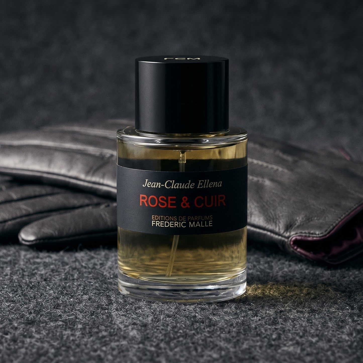 Frederic Malle Rose & Cuir EDP on smoke-grey wool with a folded pair of driving gloves to the side