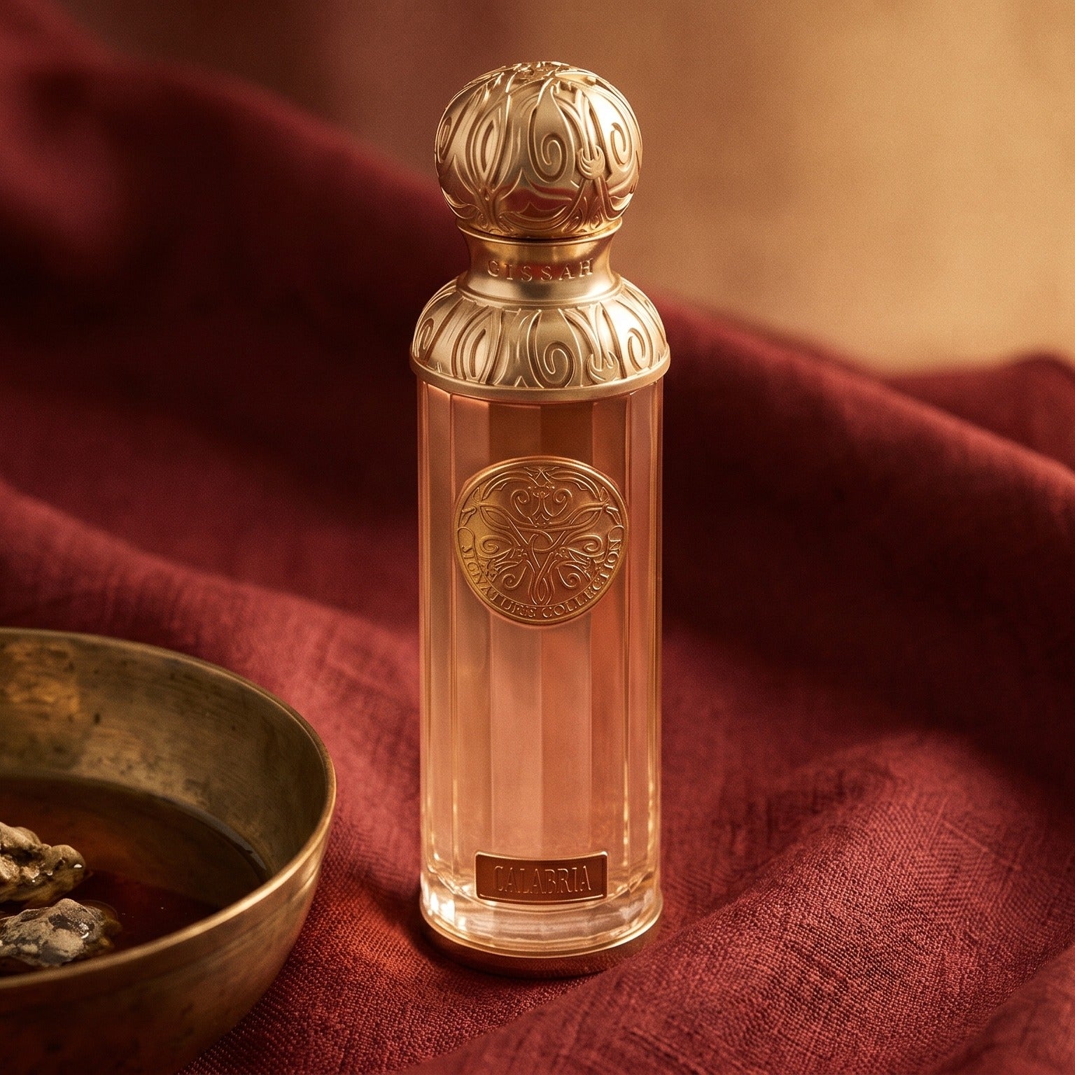 Gissah Calabria on deep caramel velvet with a small copper jar of resin balm