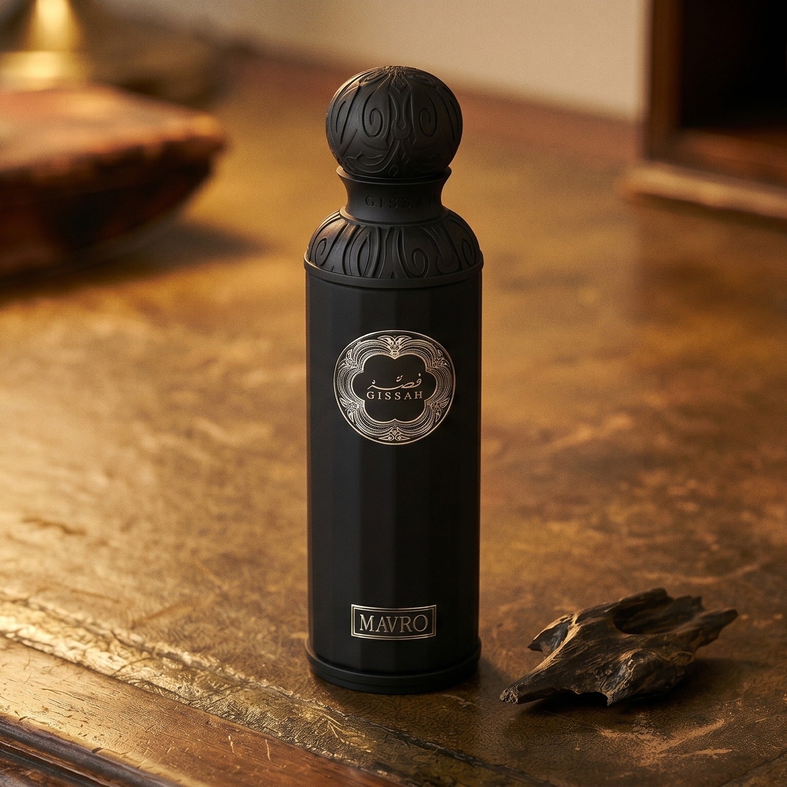 Gissah Mavro EDP on dark tan leather desk with a brass lamp casting a warm pool of light