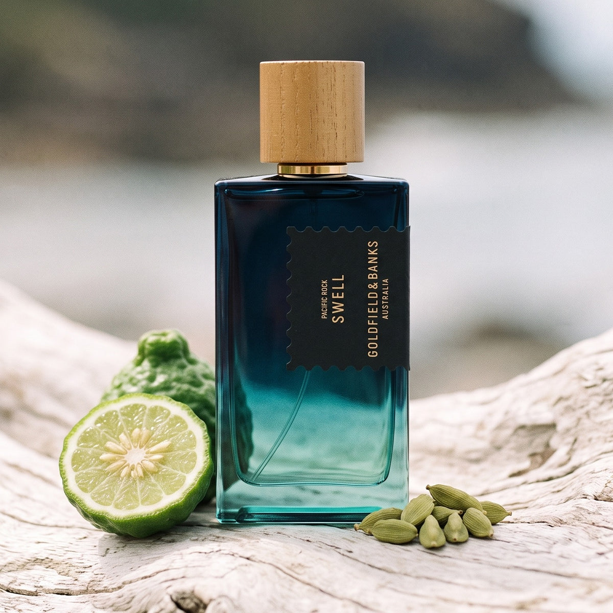 Goldfield & Banks Pacific Rock Swell Extrait de Parfum on pale weathered driftwood with bergamot and cardamom