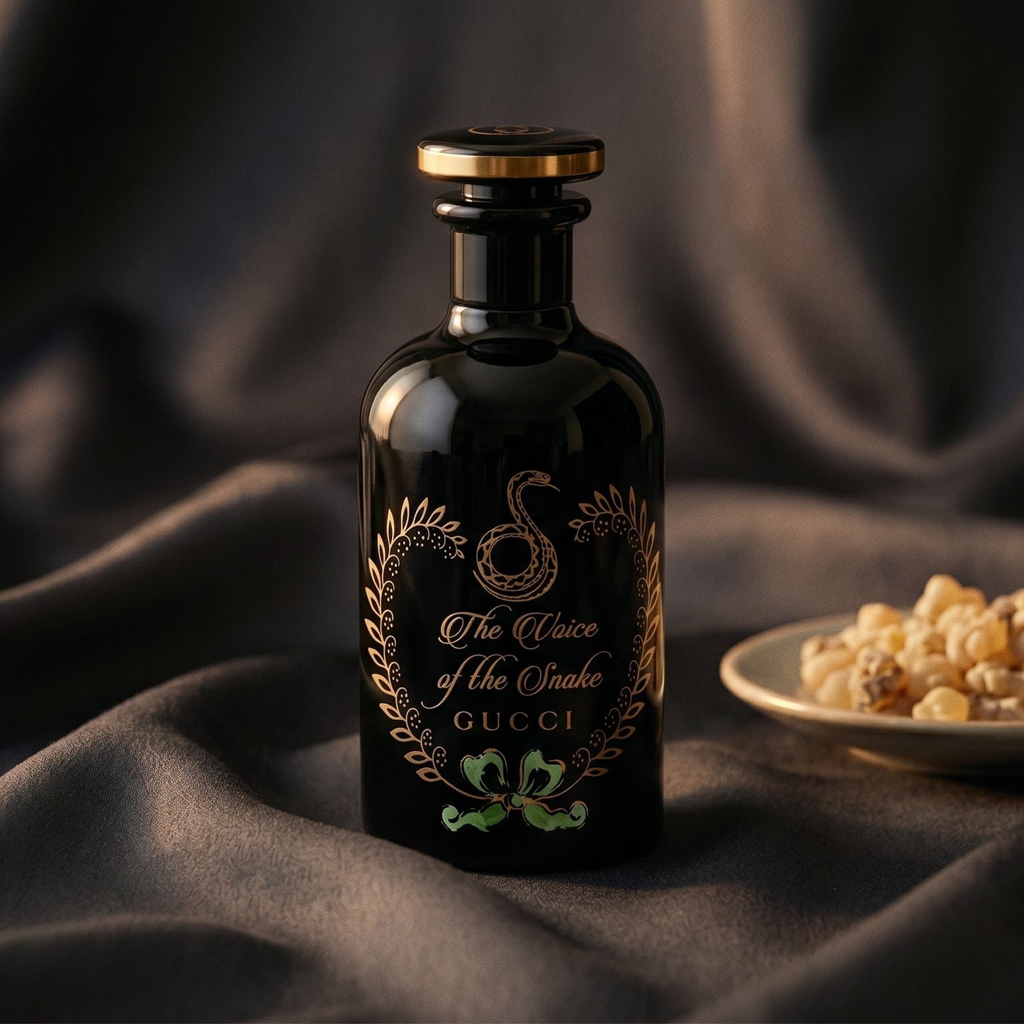 Gucci The Voice of the Snake EDP on onyx linen with dried rose petals and resin drops intermixed