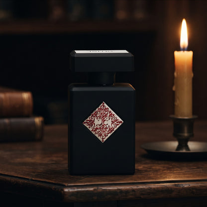 Initio Blessed Baraka EDP on aged teak with a candle burning gently to frame-right