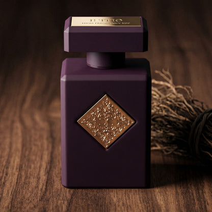 Initio High Frequency EDP on smoked ebony with a bundle of cedar twigs resting diagonally