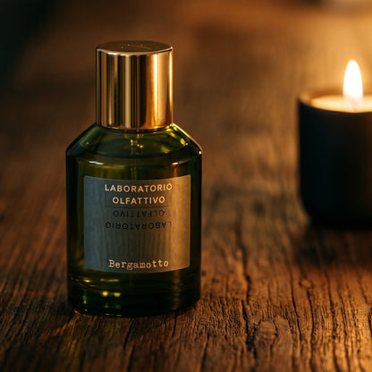 Laboratorio Olfattivo Bergamotto EDP on aged maple with a slender candlestick and drifting smoke