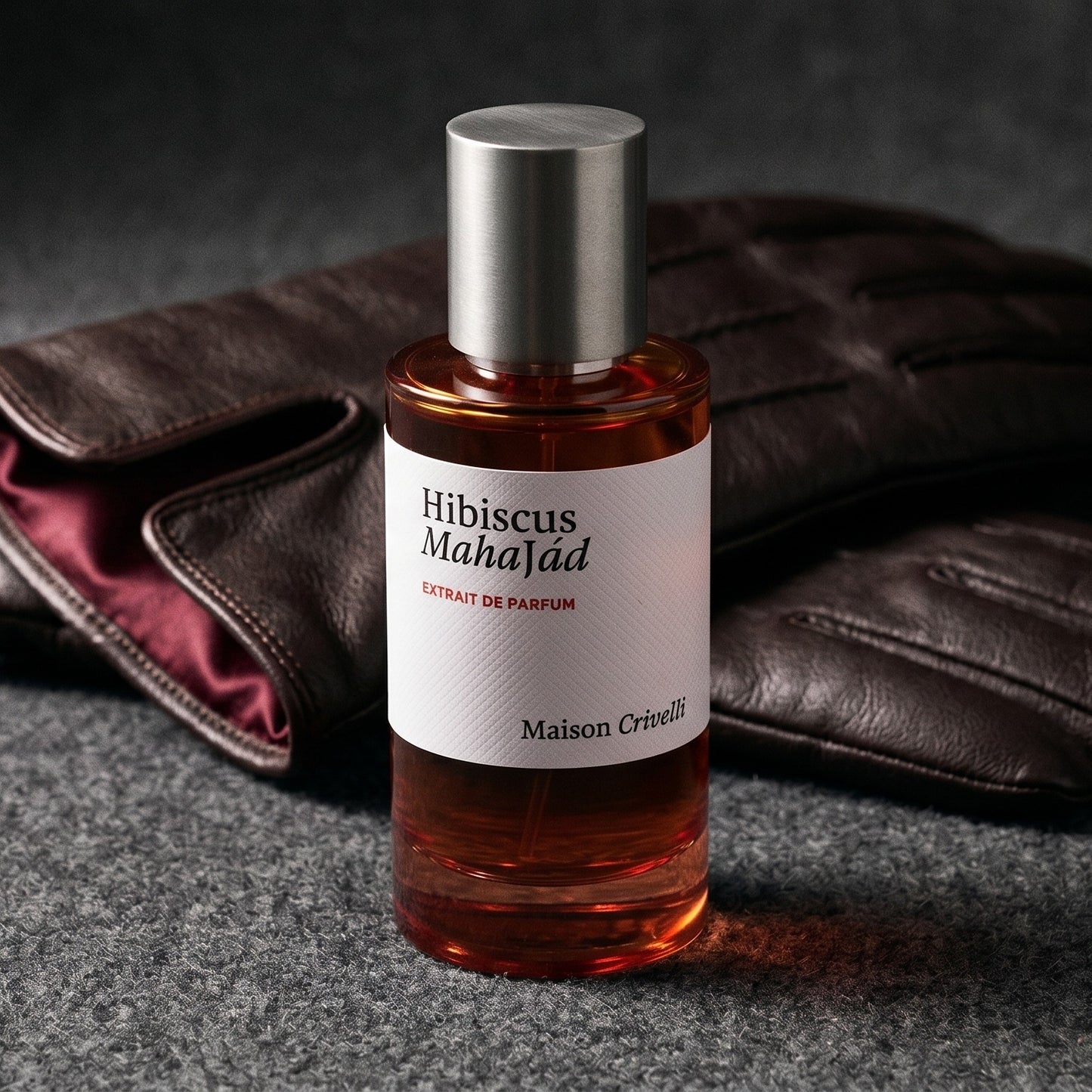 Maison Crivelli Hibiscus Mahajad EDP on oxblood leather footstool with a cashmere throw gathered behind