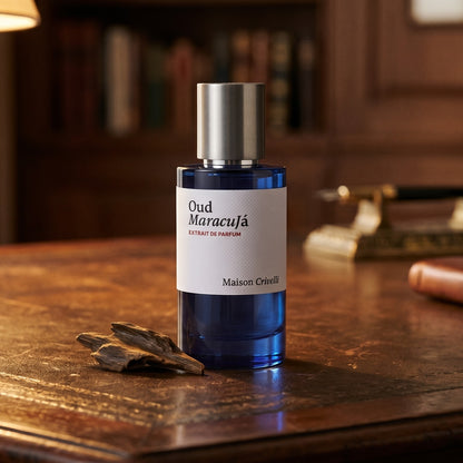 Maison Crivelli Oud Maracuja on cognac leather bench with a curled strip of birch bark nearby
