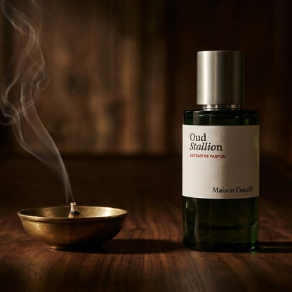 Maison Crivelli Oud Stallion EDP on charcoal slate with a slender oud chip and drifting incense smoke