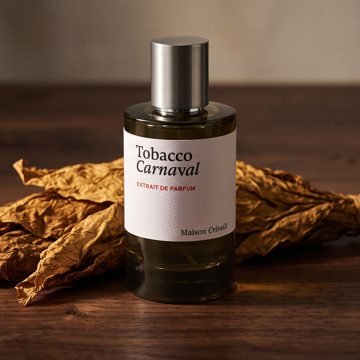 Maison Crivelli Tobacco Carnaval Extrait de Parfum on dark walnut with dried tobacco leaves
