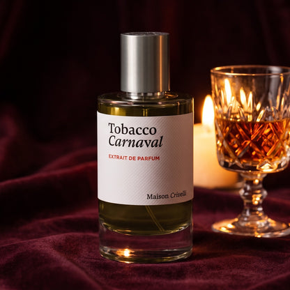 Maison Crivelli Tobacco Carnaval Extrait de Parfum on deep burgundy velvet with a glass of amber liqueur