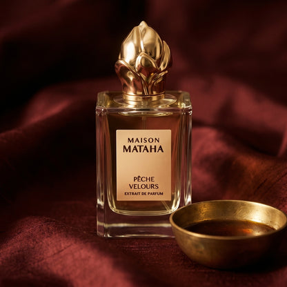 Maison Mataha Peche Velours on raw silk of oxblood color with a brass bowl of ambergris tincture