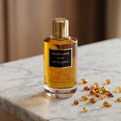 Mancera Amore Caffe on warm ivory travertine with labdanum chunks clustered by the base