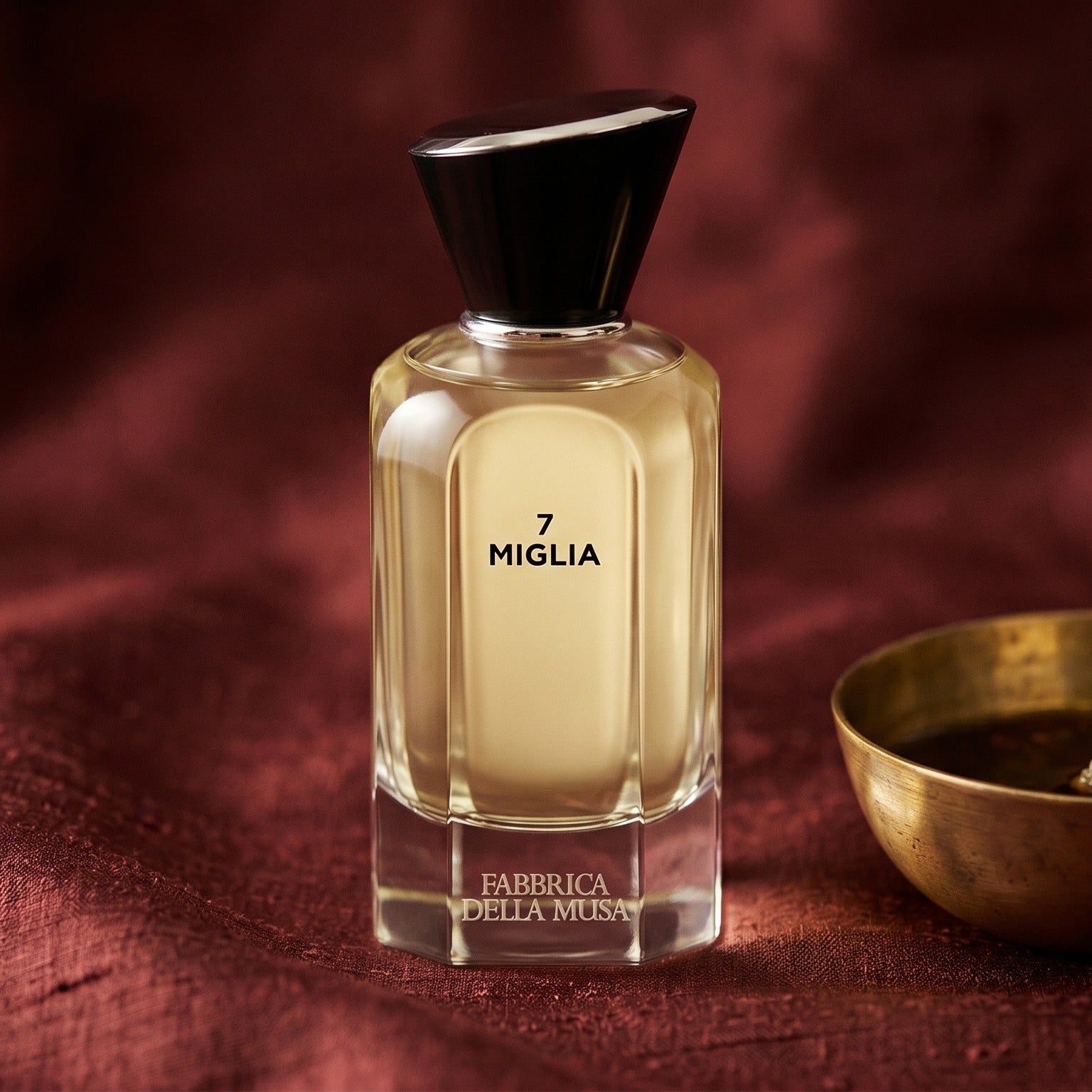 Miglia Fabbrica della Musa EDP on cinnamon-tone silk with a shallow saucer of warm benzoin resin