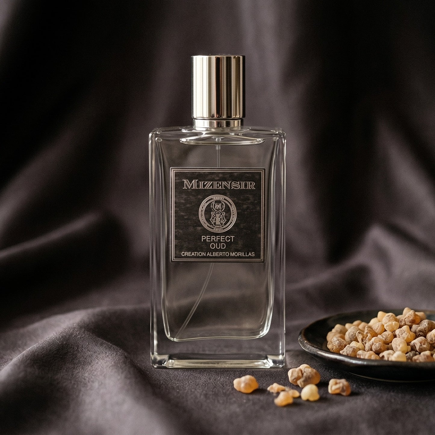 Mizensir Perfect Oud EDP on burnt-orange silk with smoldering agarwood on a stone dish