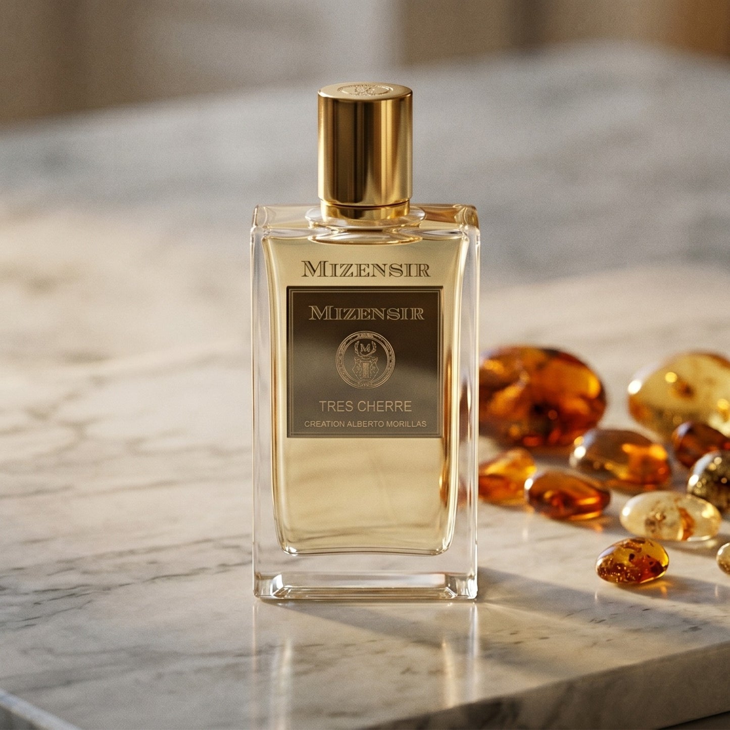 Mizensir Tres Cherre EDP on warm taupe marble with copal beads spilling from a small dish