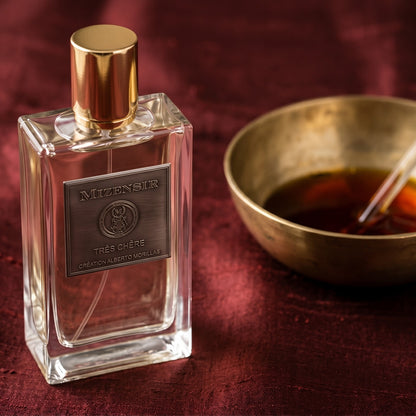 Mizensir Tres Cherre EDP on deep caramel velvet with a small copper jar of resin balm