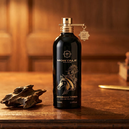 Montale Arabians Tonka on worn saddle-leather surface with oud resin chunks in a small dish