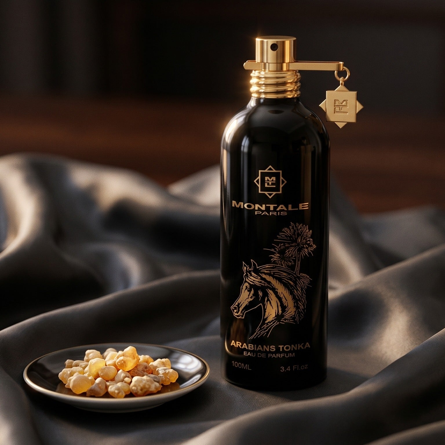 Montale Arabians Tonka on burnt-orange silk with smoldering agarwood on a stone dish