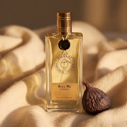 Nicolai Kiss Me Intense EDP on sand-colored mohair with a dried apricot split in two