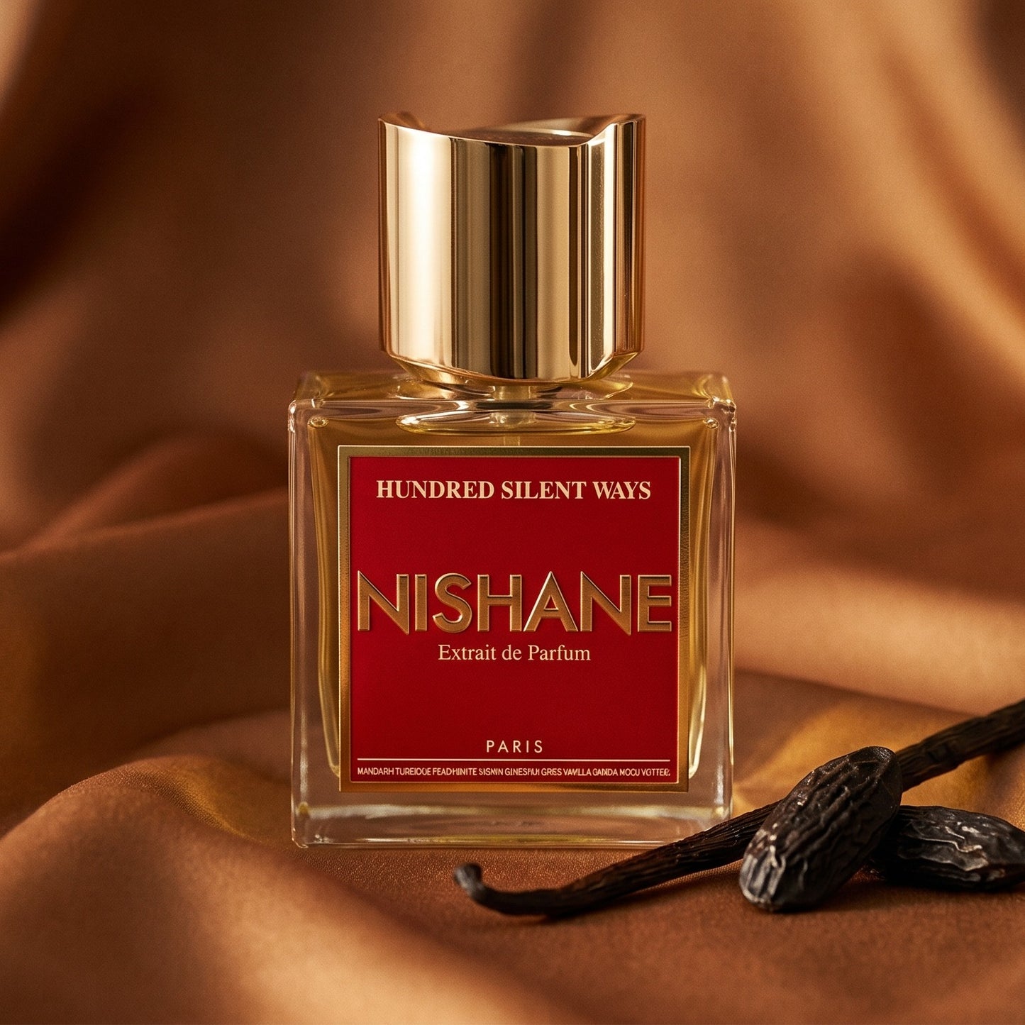 Nishane Hundred Silent Ways EDP on amber satin with a spiral of dried orange peel and vanilla