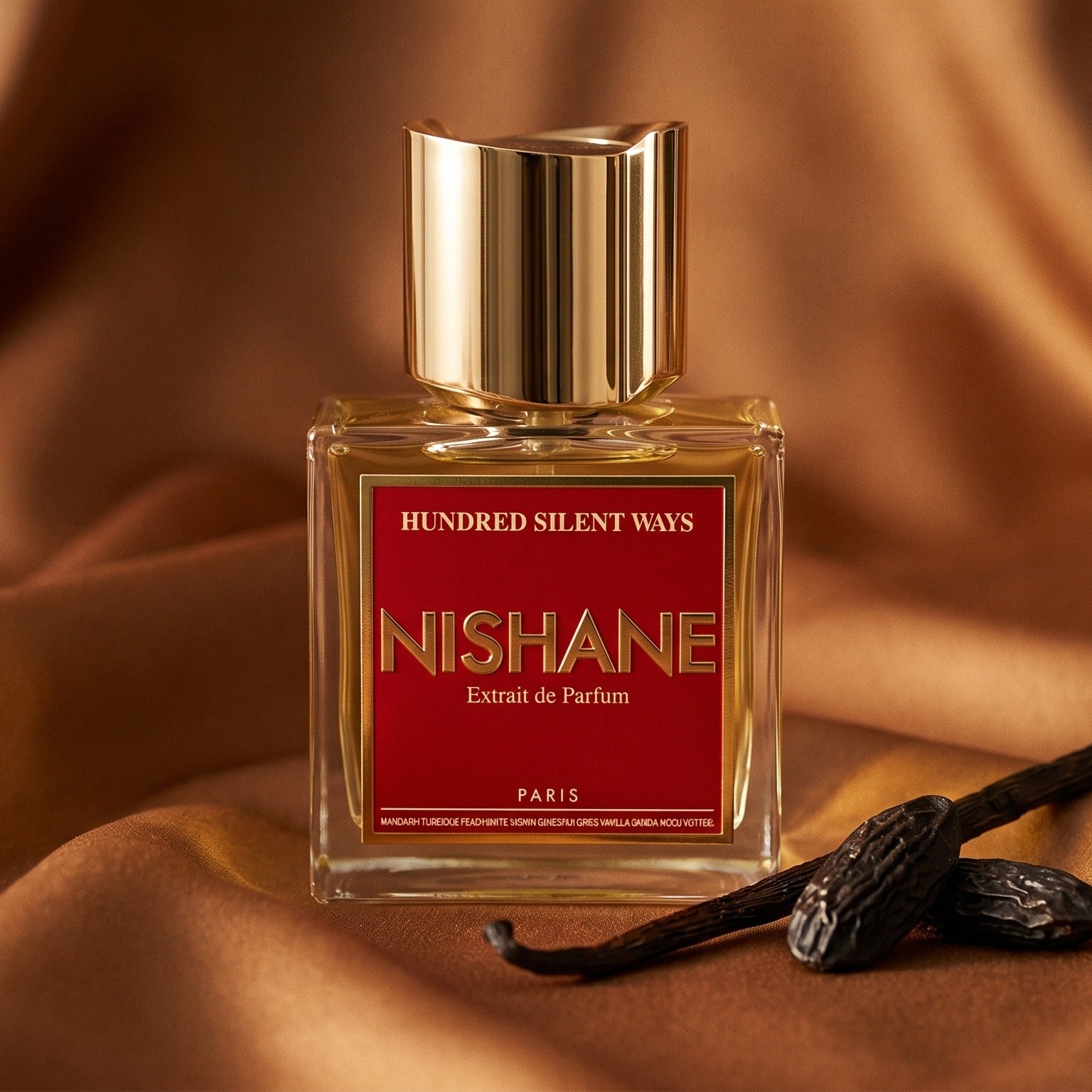 Nishane Hundred Silent Ways EDP on amber satin with a spiral of dried orange peel and vanilla