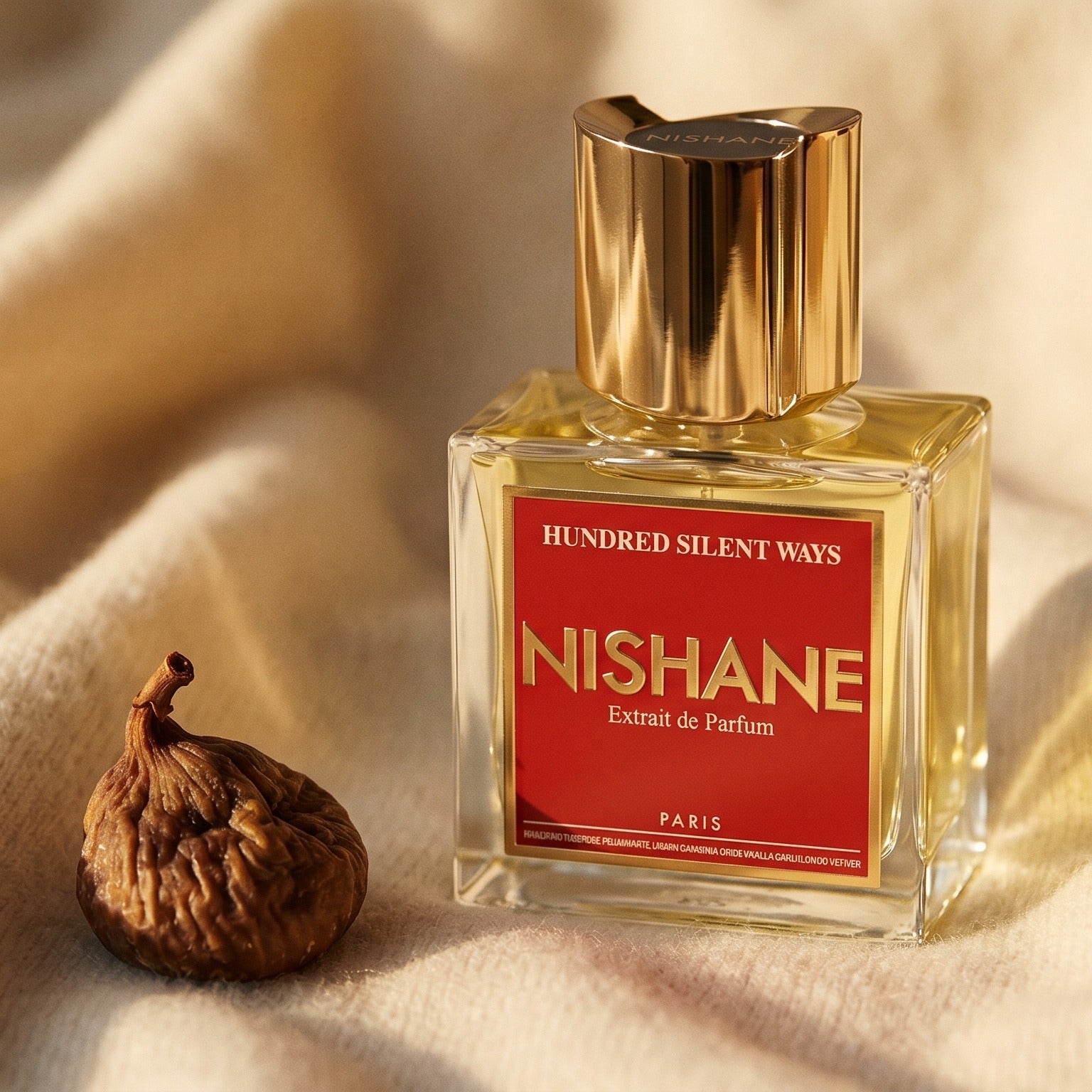 Nishane Hundred Silent Ways EDP on oatmeal wool with a scatter of candied chestnuts