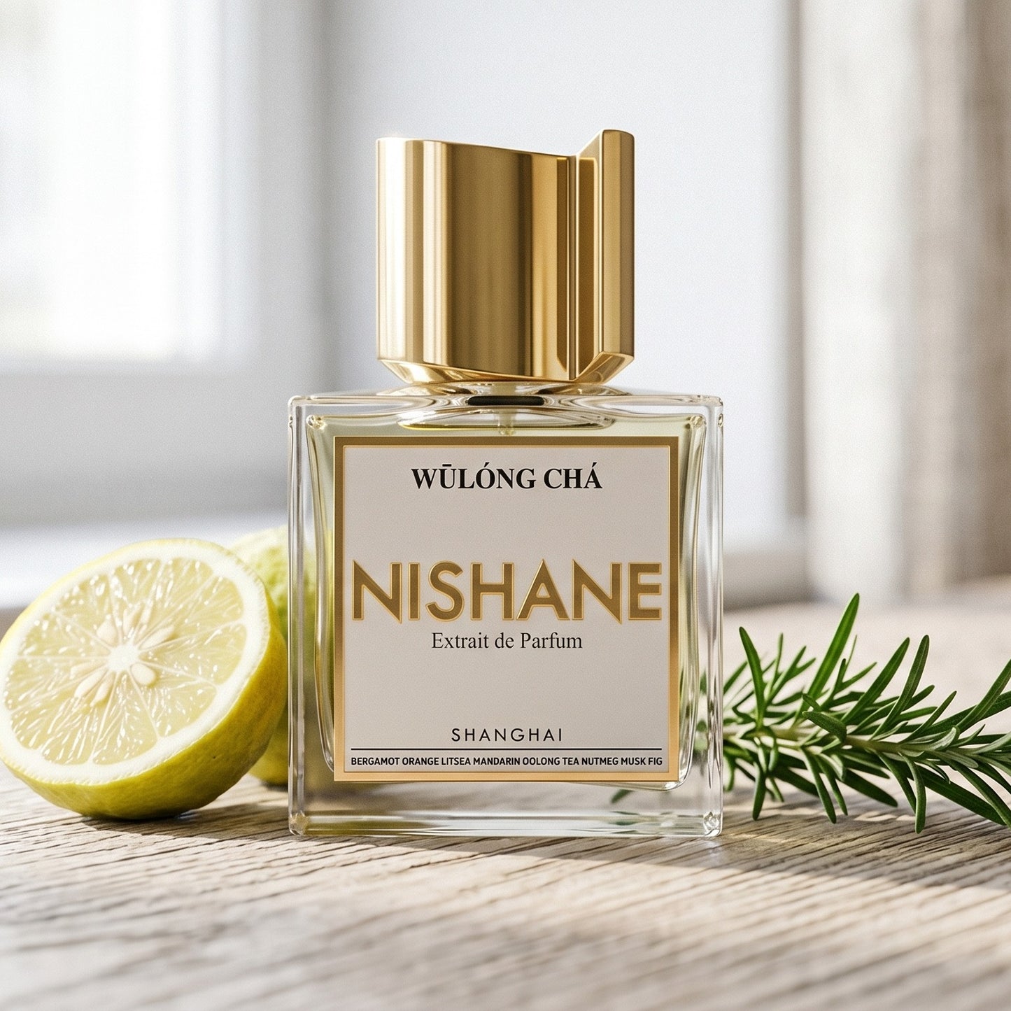 Nishane Wulong Cha EDP on bleached oak with a halved bergamot and a sprig of rosemary