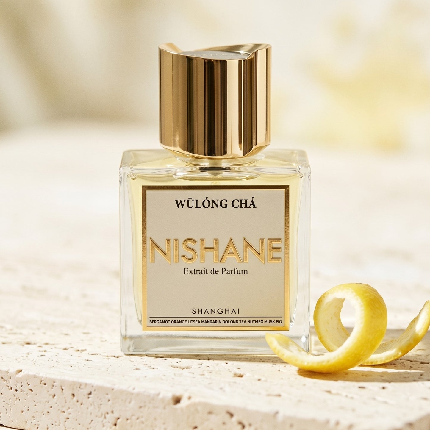 Nishane Wulong Cha EDP on alabaster surface with a yuzu peel shaved in thin curls